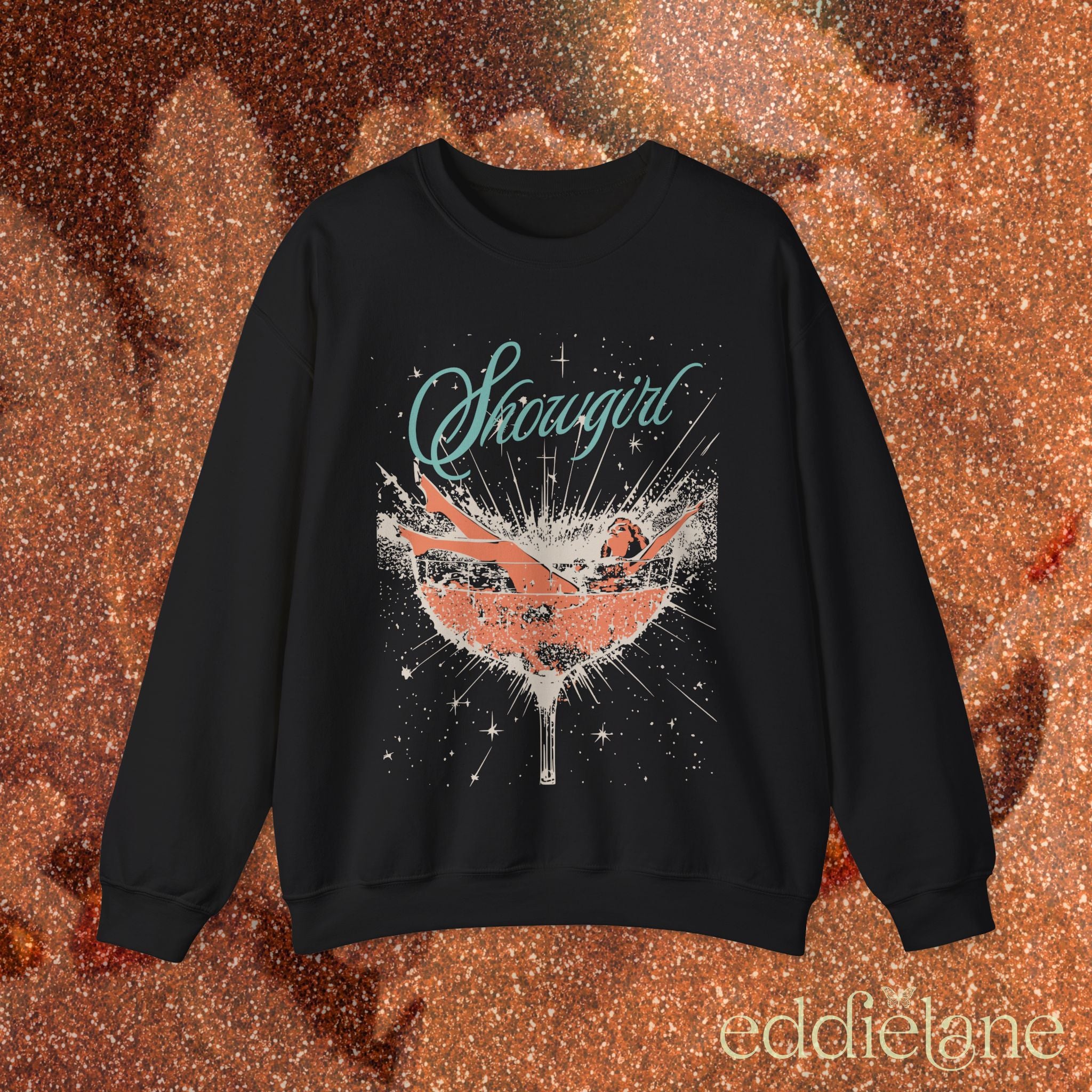 black sweatshirt with a graphic design of a woman in a martini glass and the word "showgirl"