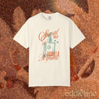 woman wearing an ivory comfort colors graphic tee with an illustration of a perfume bottle and the words "sweat and vanilla perfume" 