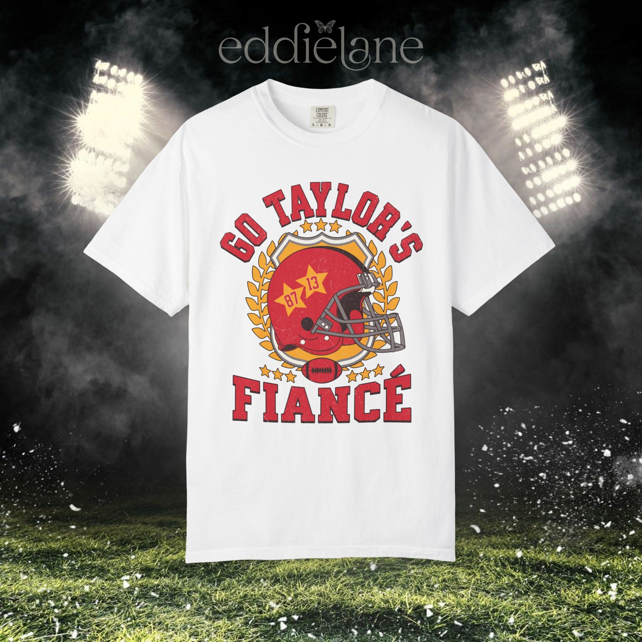 a white t-shirt with a vintage football helmet design and text that says "go taylor's fiance"