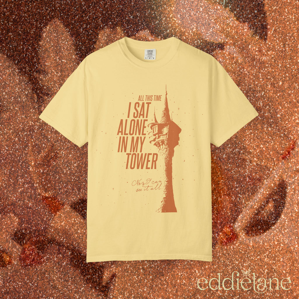 a yellow comfort colors shirt with a graphic of a tower and the words "all this time i sat alone in my tower"