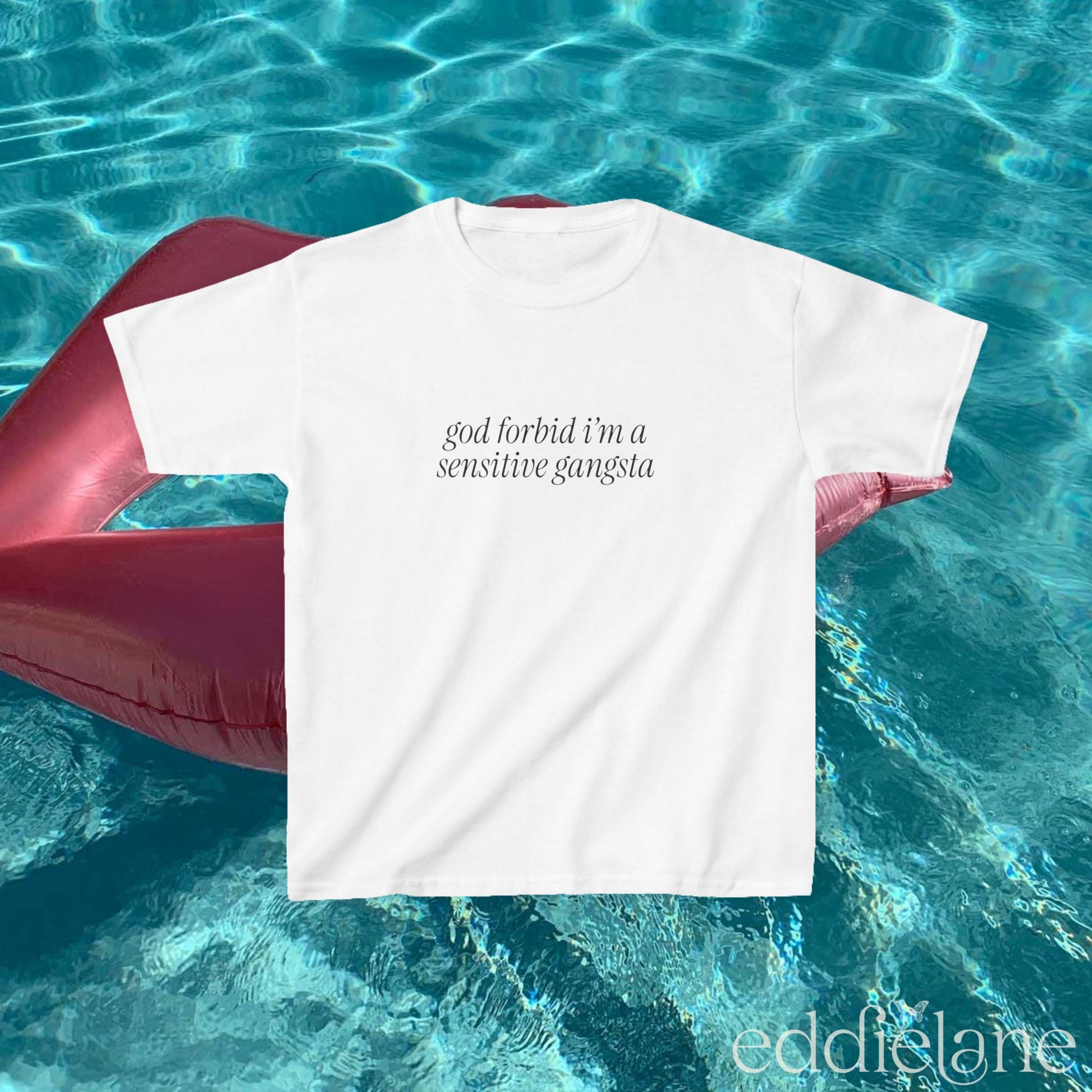 White baby tee that says "god forbid i'm a sensitive gangsta" inspired by amaya from love island usa.
