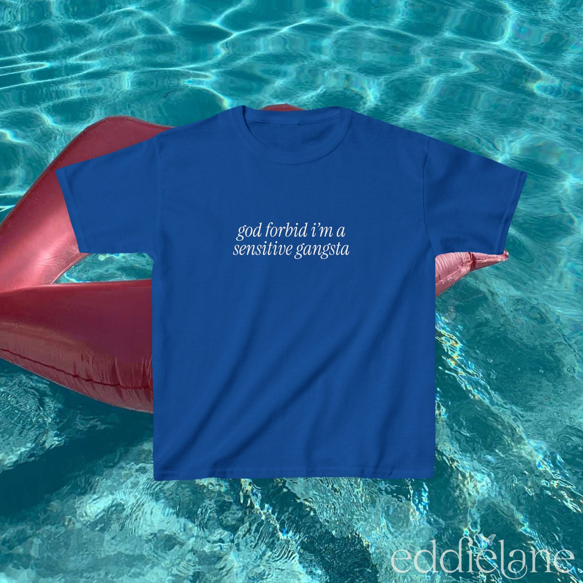Blue baby tee that says "god forbid i'm a sensitive gangsta" inspired by amaya from love island usa.