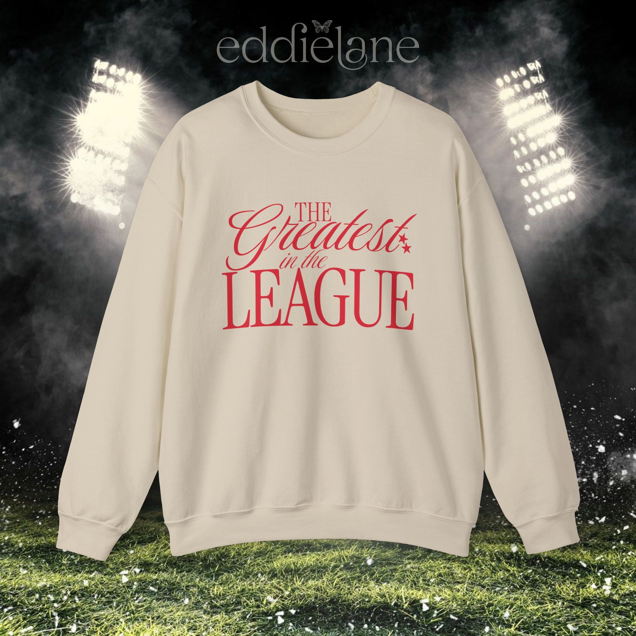 a sand crewneck sweatshirt that says "the greatest in the league"