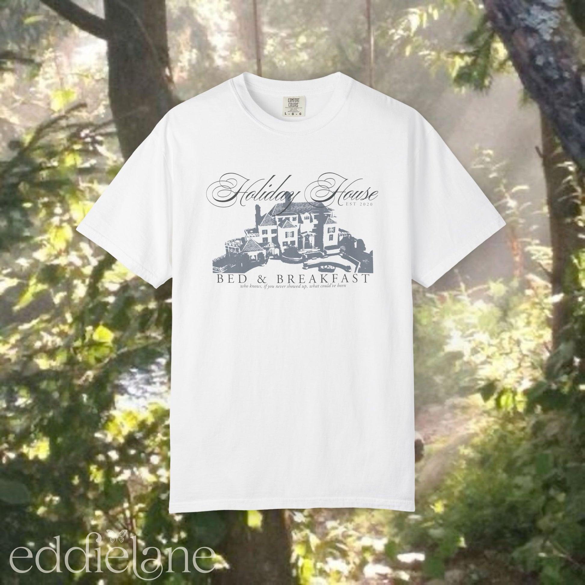 White graphic t-shirt with 'Holiday House Bed & Breakfast' design, inspired by the last great american dynasty from folklore by taylor swift.