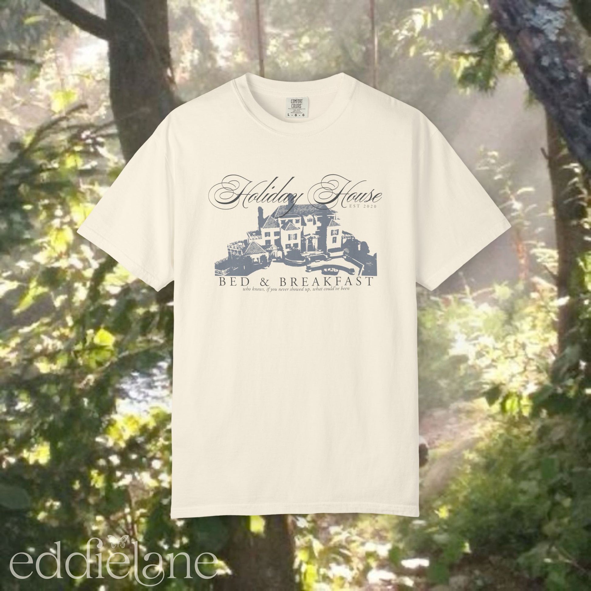 Ivory graphic t-shirt with 'Holiday House Bed & Breakfast' design, inspired by the last great american dynasty from folklore by taylor swift.