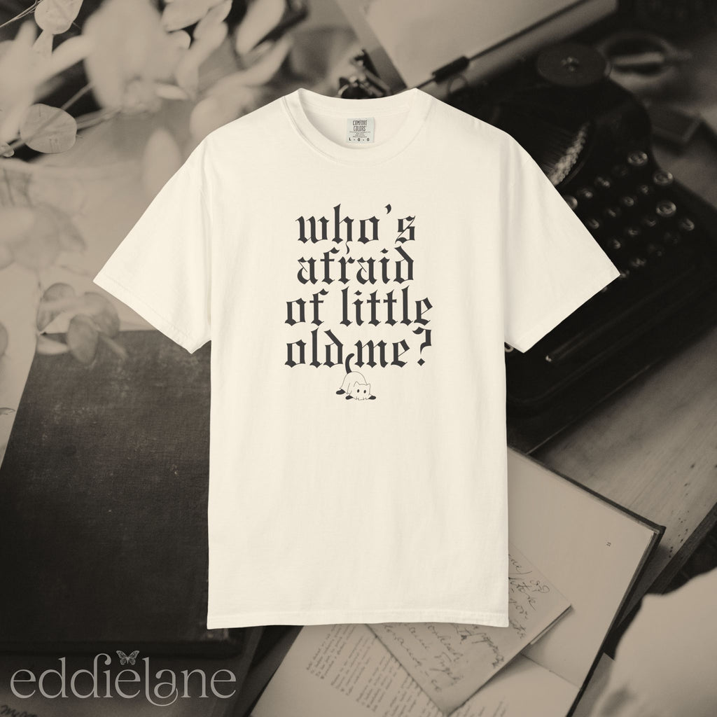 an ivory comfort colors t-shirt that says "who's afraid of little old me" with a graphic of a cat wearing a ghost costume