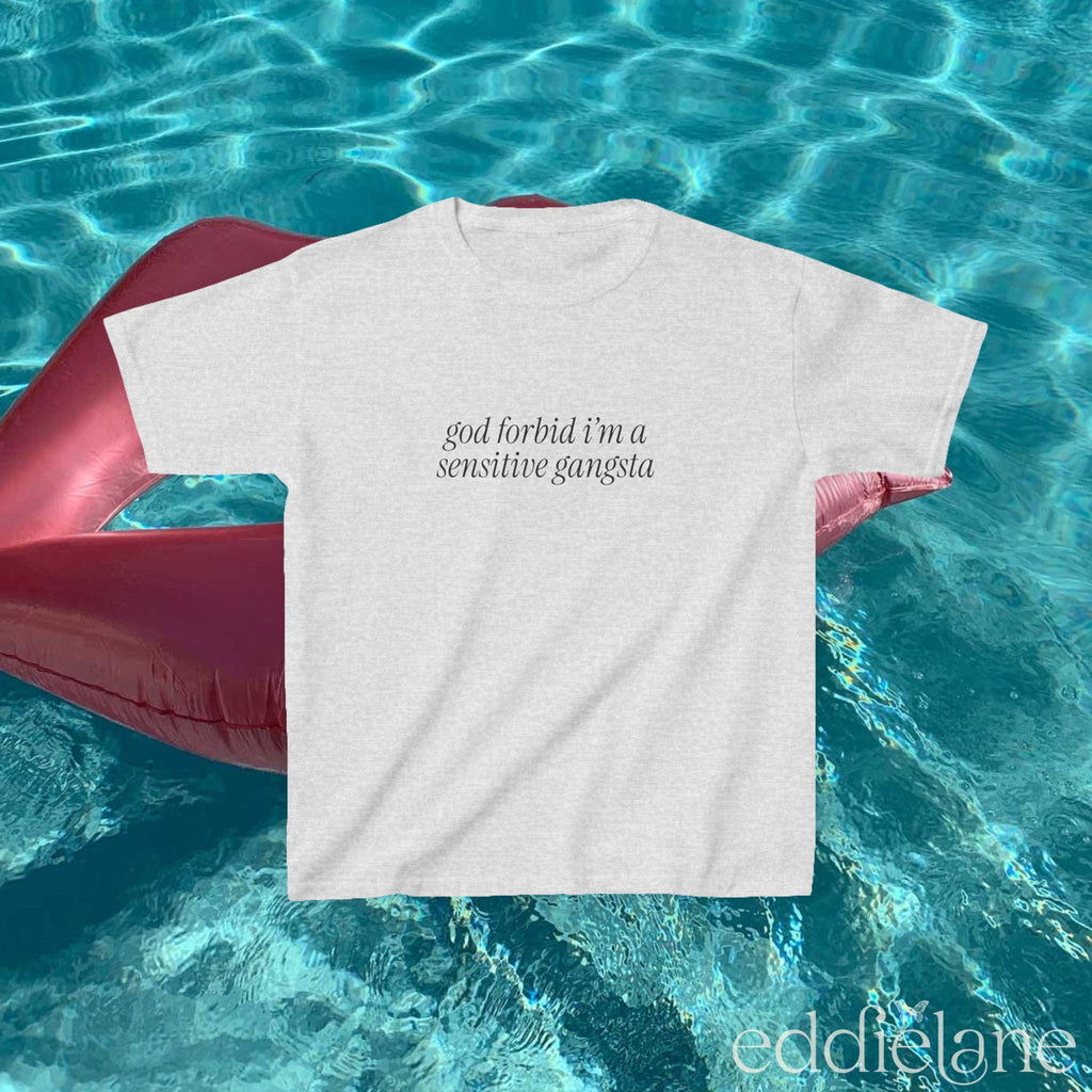 Ash Gray baby tee that says "god forbid i'm a sensitive gangsta" inspired by amaya from love island usa.