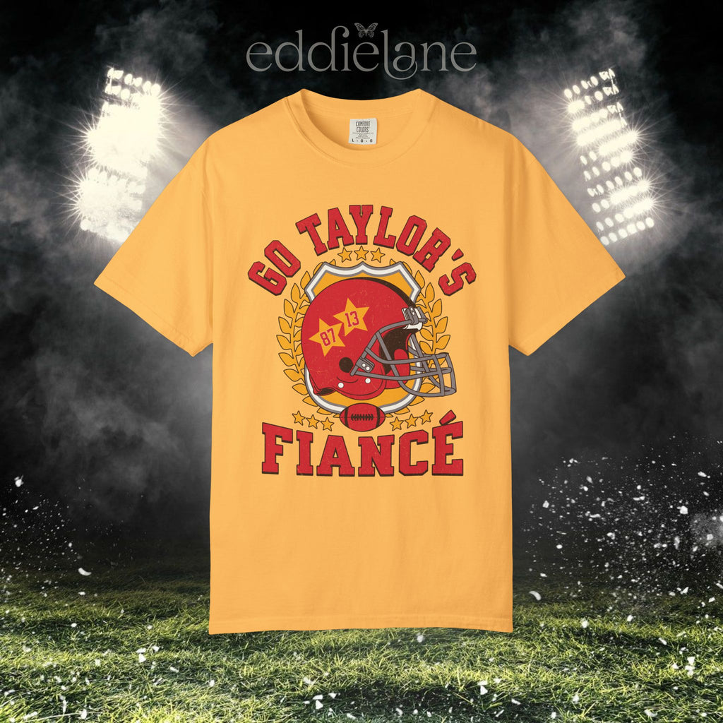 a yellow t-shirt with a vintage football helmet design and text that says "go taylor's fiance"