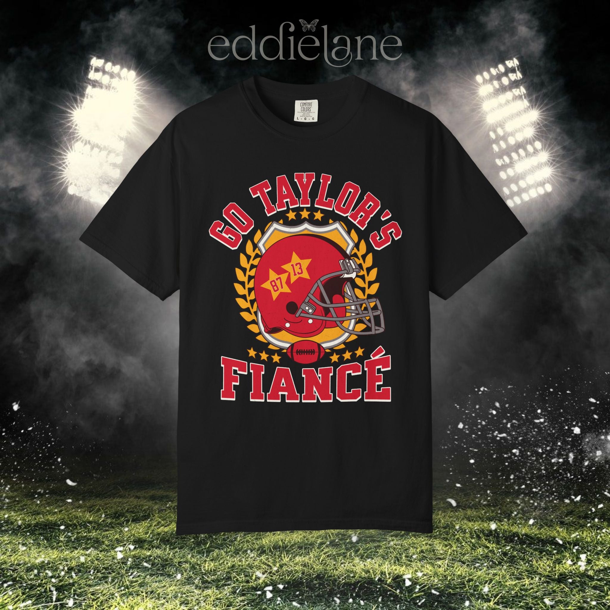a black t-shirt with a vintage football helmet design and text that says "go taylor's fiance"
