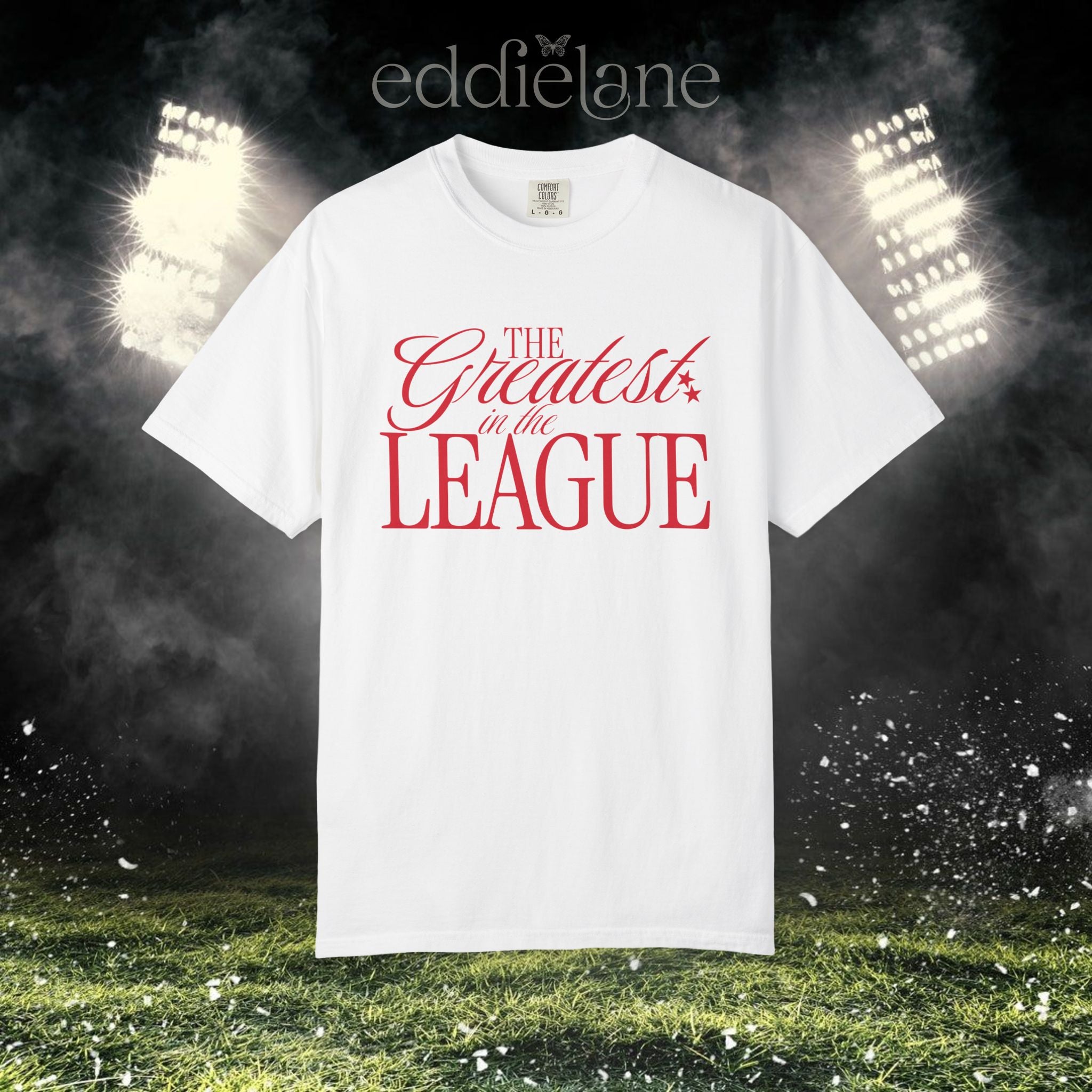 a white Comfort Colors t-shirt that says 'the greatest in the league' 