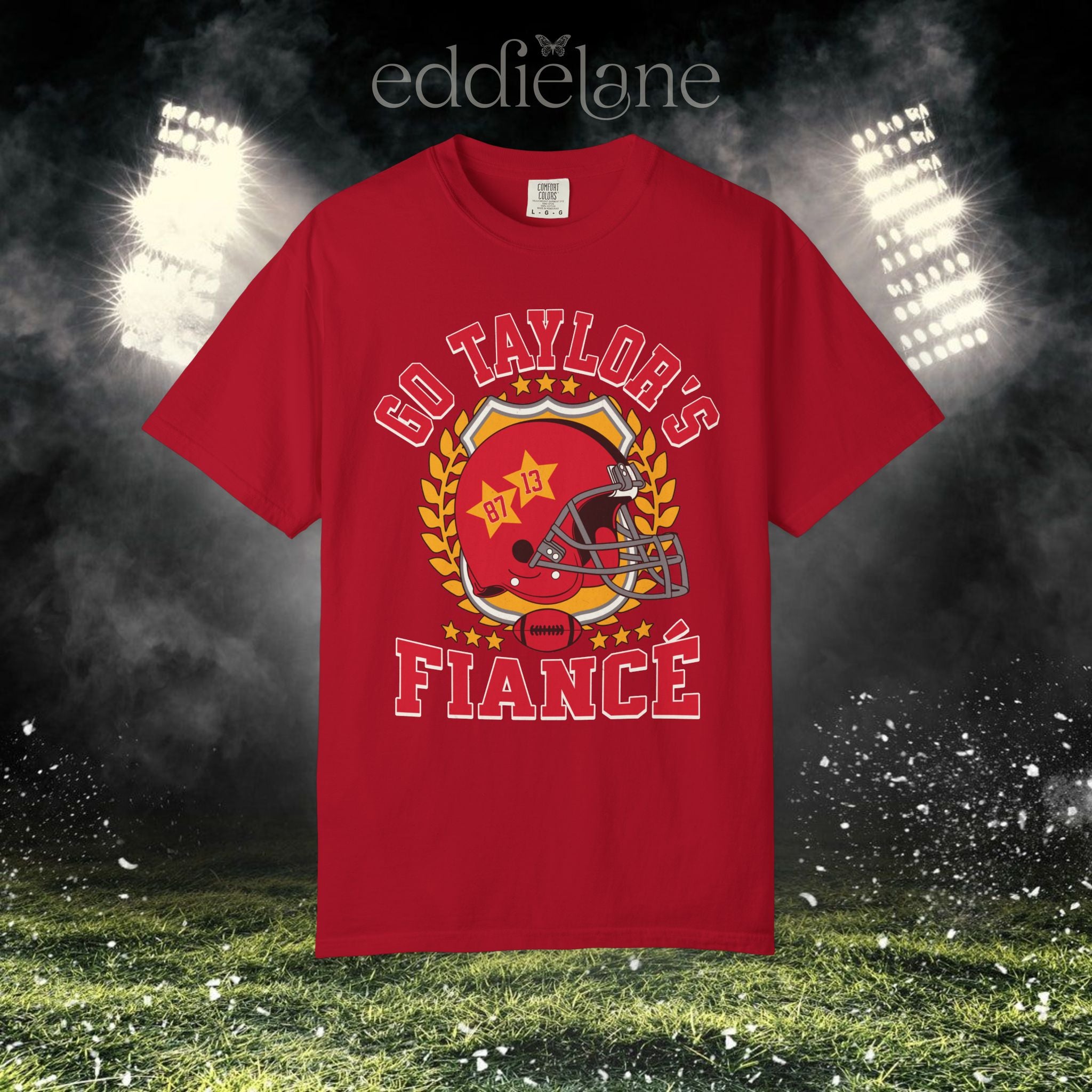 a red t-shirt with a vintage football helmet design and text that says "go taylor's fiance"
