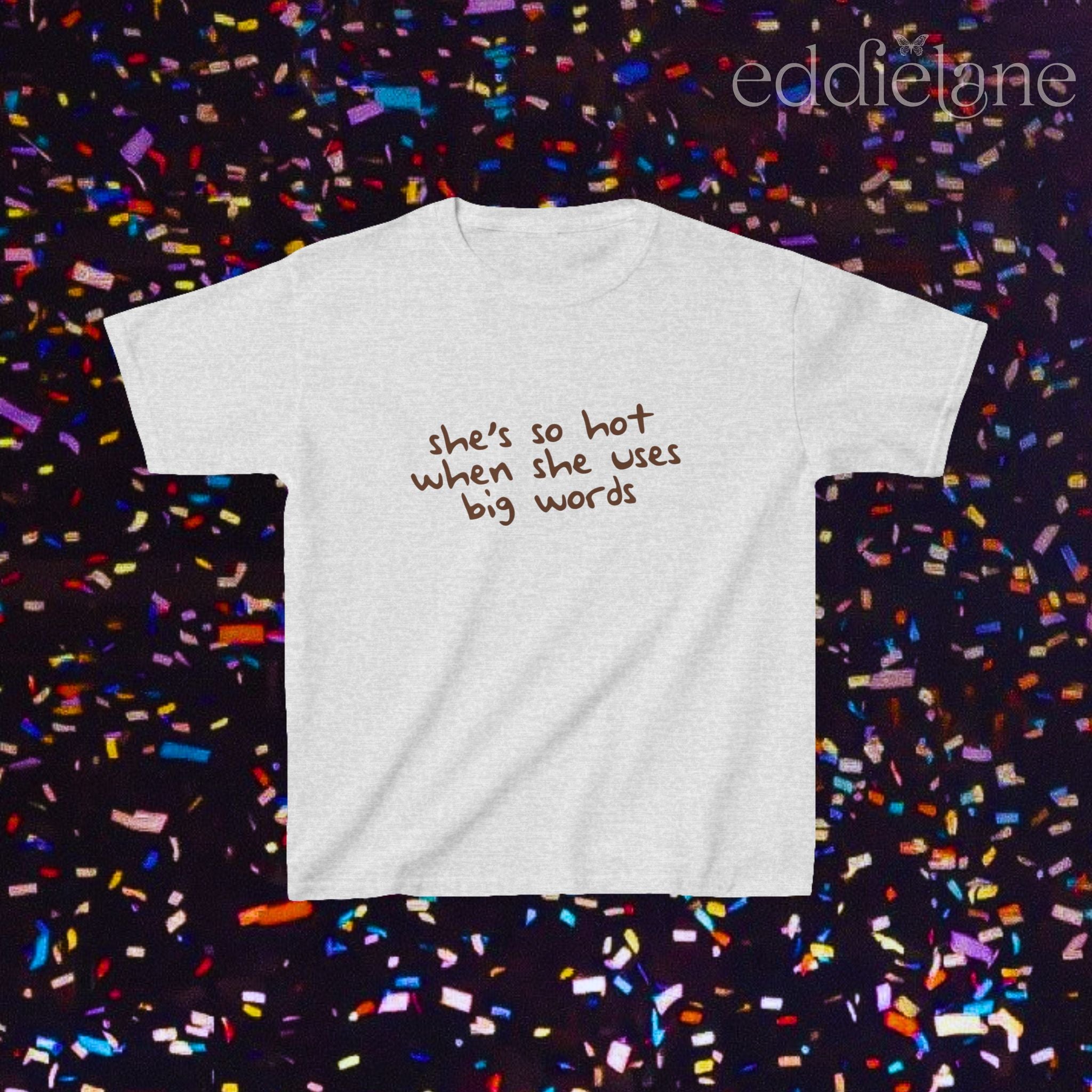 a gray baby tee that says "she's so hot when she uses big words"