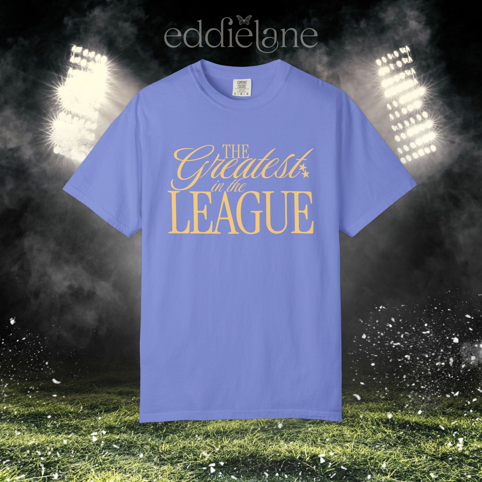 a flo blue Comfort Colors t-shirt that says 'the greatest in the league' 