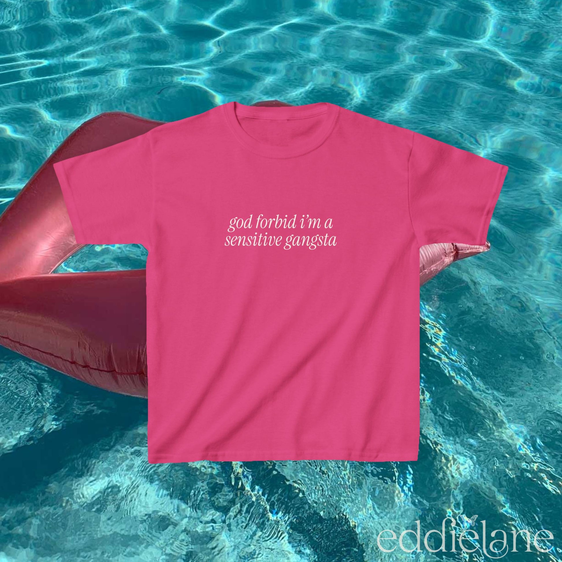 Pink baby tee that says "god forbid i'm a sensitive gangsta" inspired by amaya from love island usa.