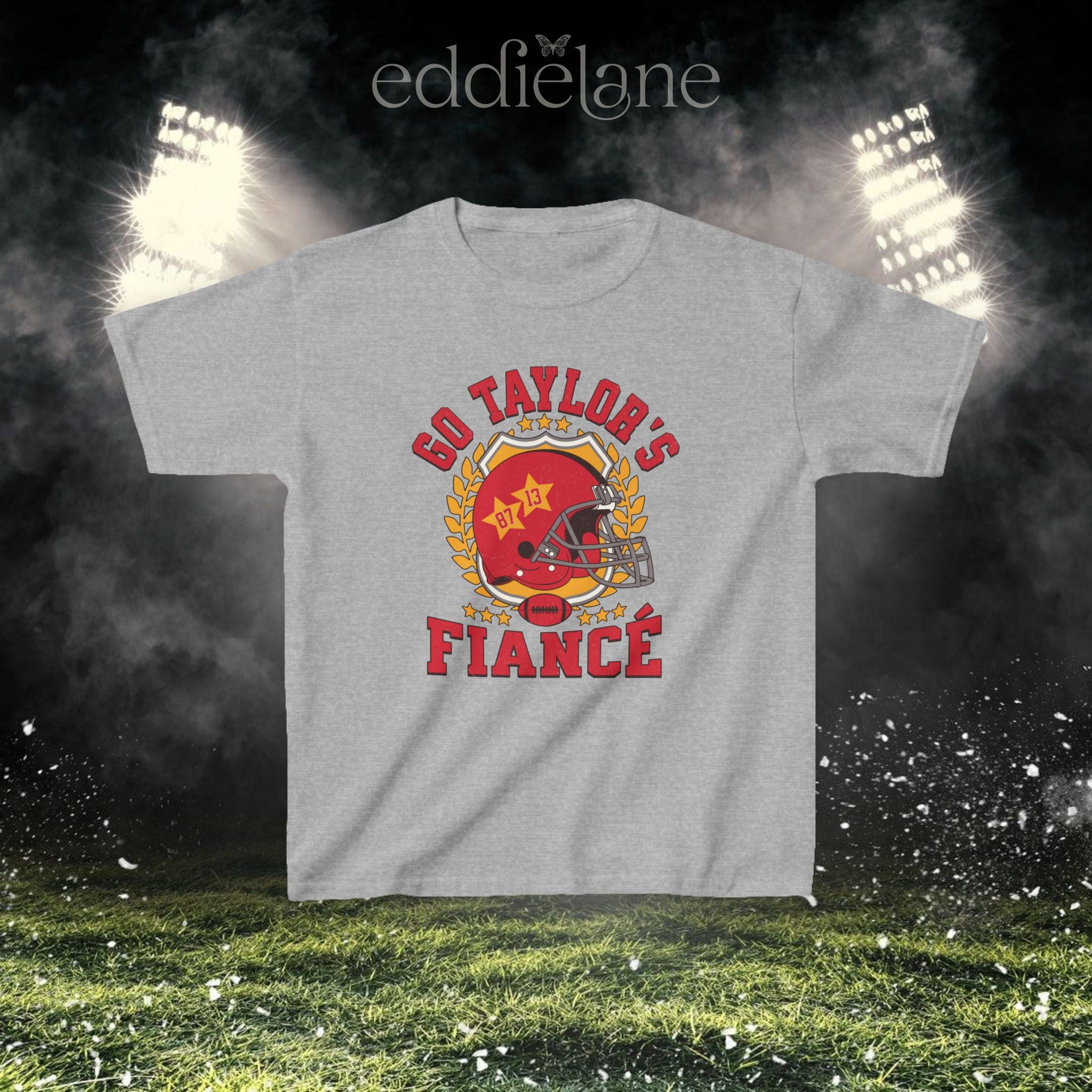 a sport gray baby tee with a vintage football helmet design and text that says "go taylor's fiance"