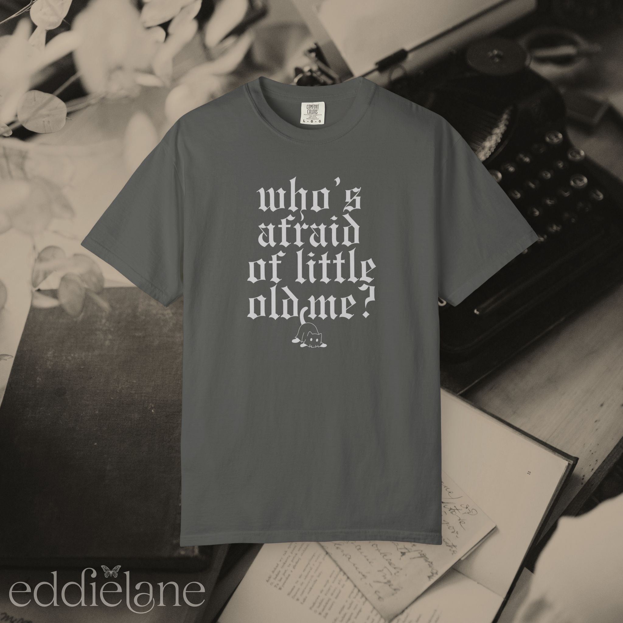 a gray comfort colors t-shirt that says "who's afraid of little old me" with a graphic of a cat wearing a ghost costume
