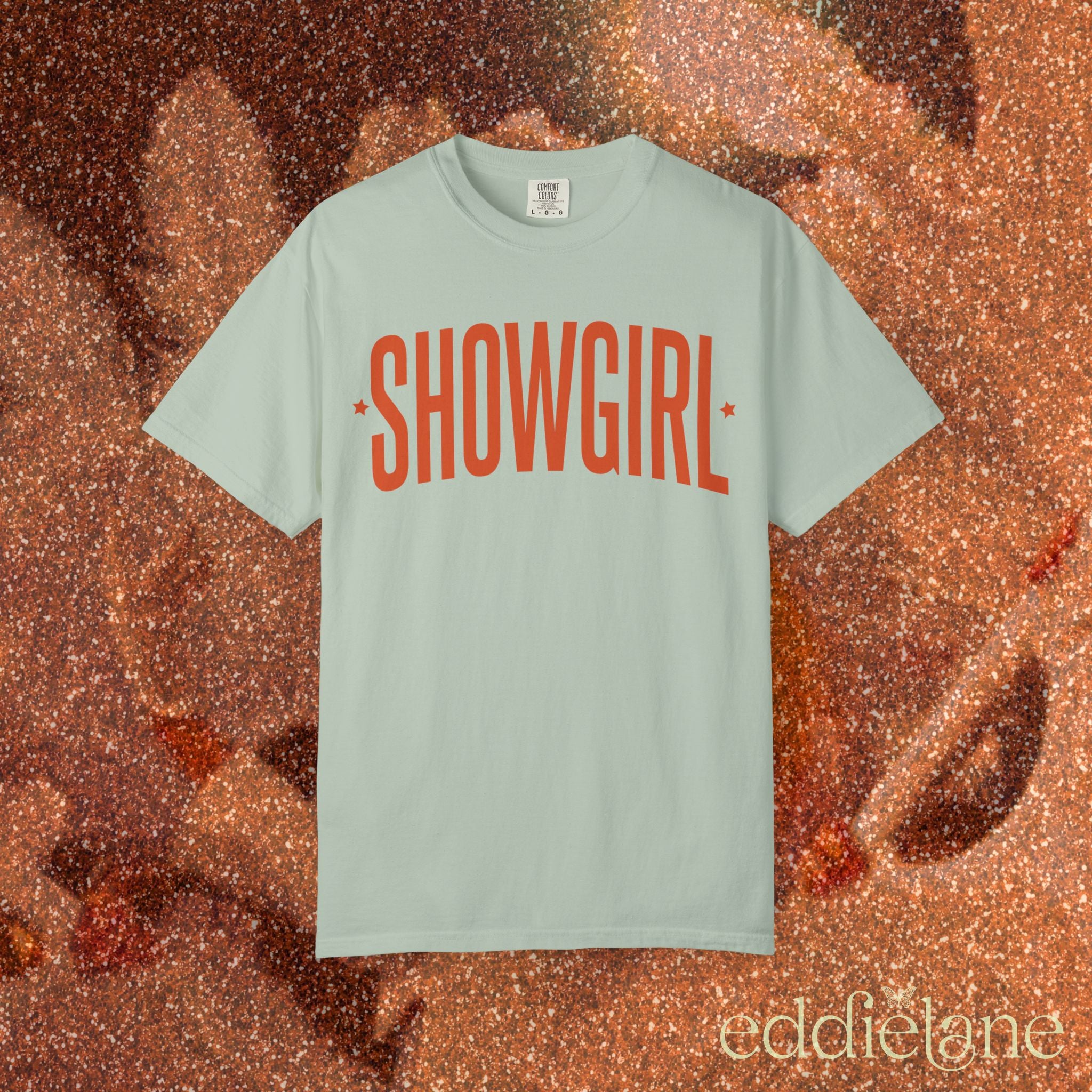 bay green comfort colors graphic tee that says 'SHOWGIRL' with two small stars 

bay green showgirl tee
