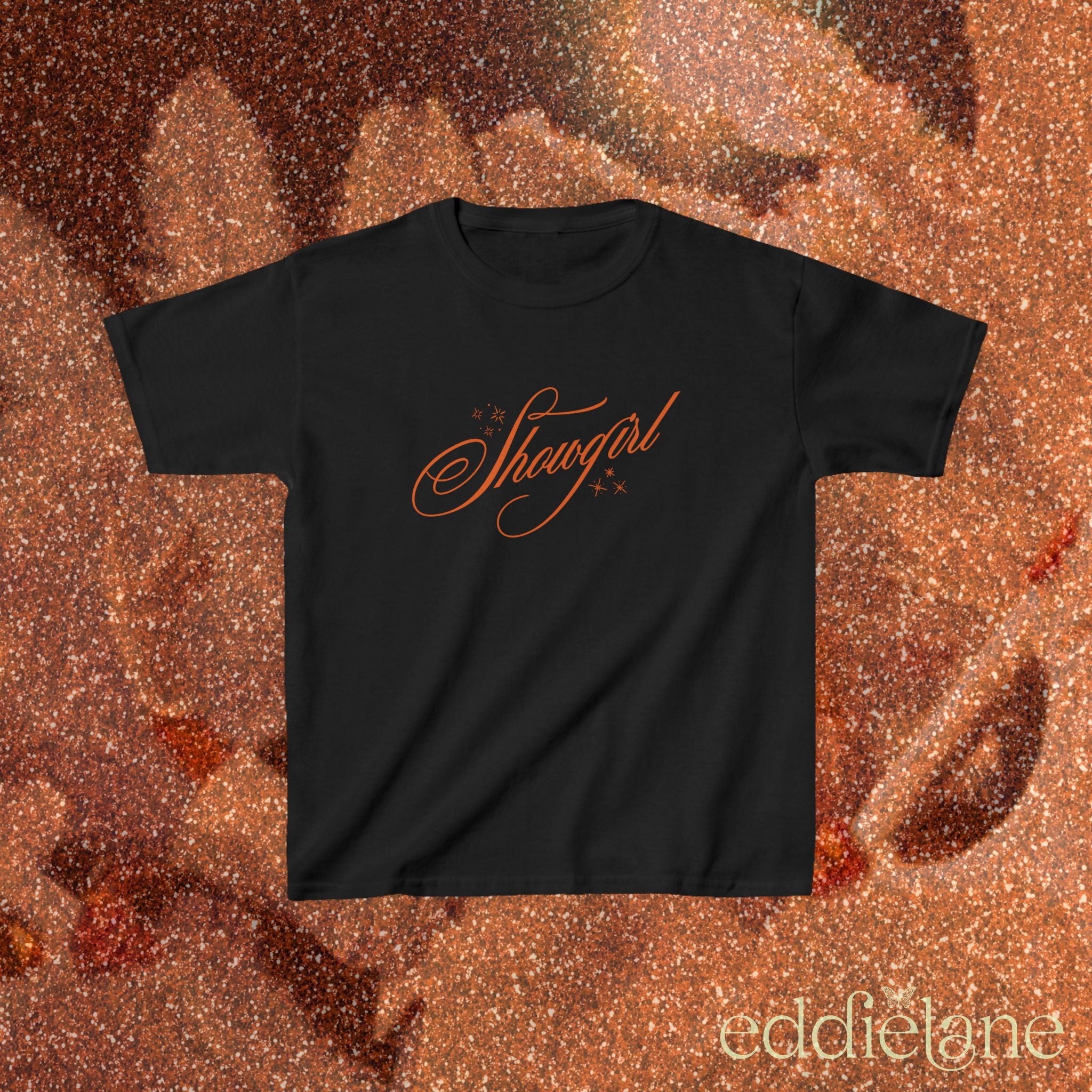 a black baby tee with cursive text that says 'Showgirl' 

black baby tee