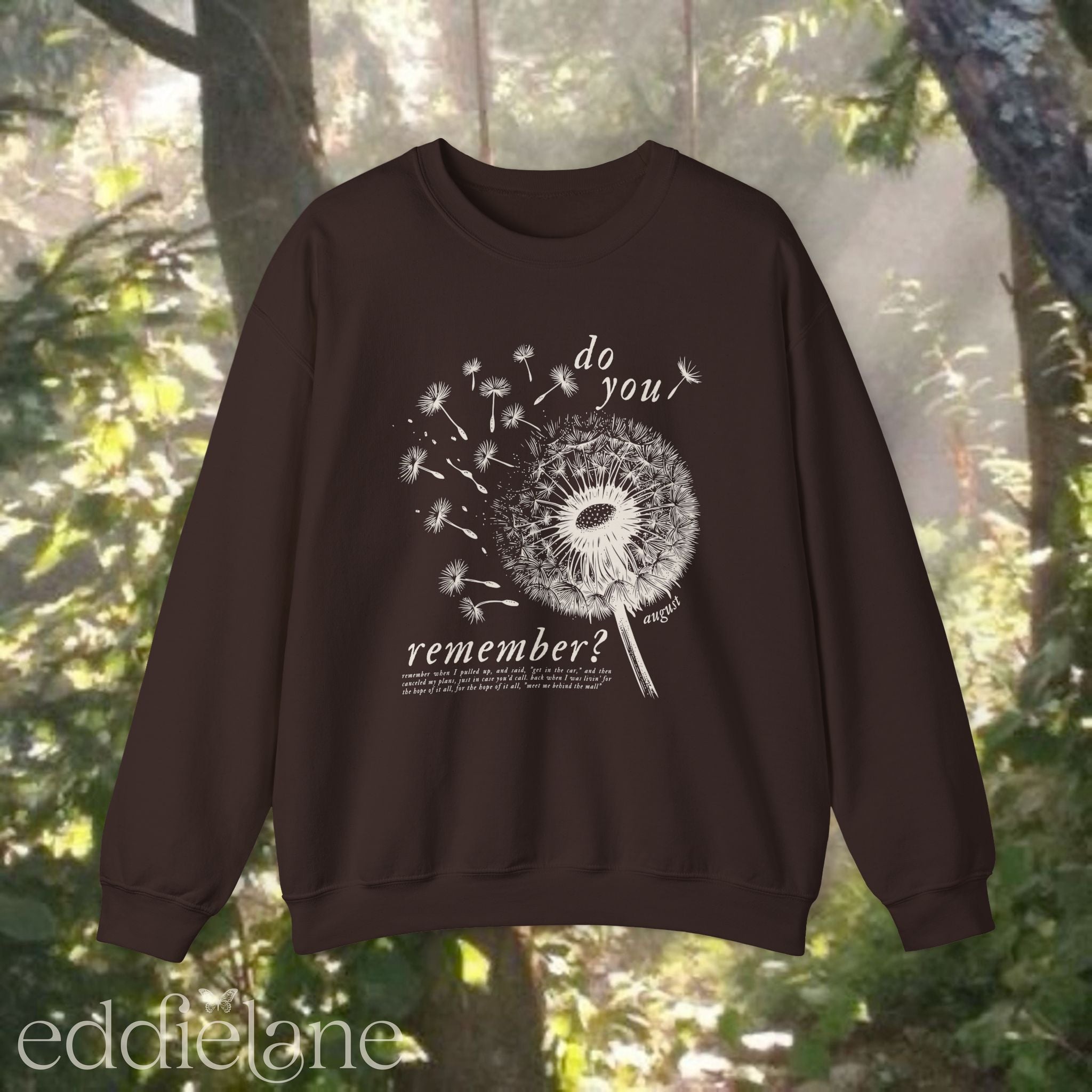 brown sweatshirt with dandelion graphic and text that says "do you remember" 