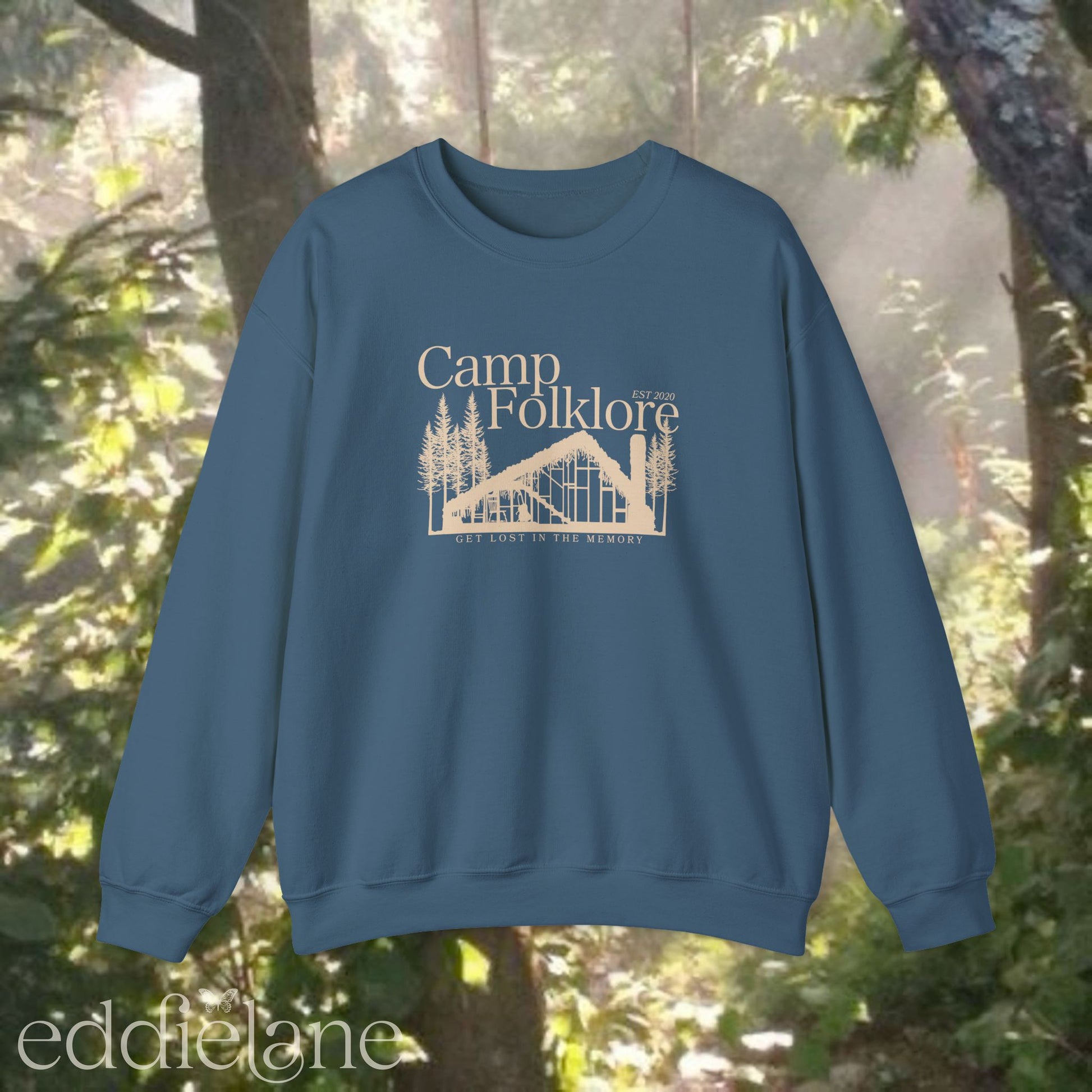 Blue sweatshirt with 'Camp Folklore' design featuring the Folklore cabin inspired by Taylor Swift's Folklore album.
camp folklore sweatshirt blue