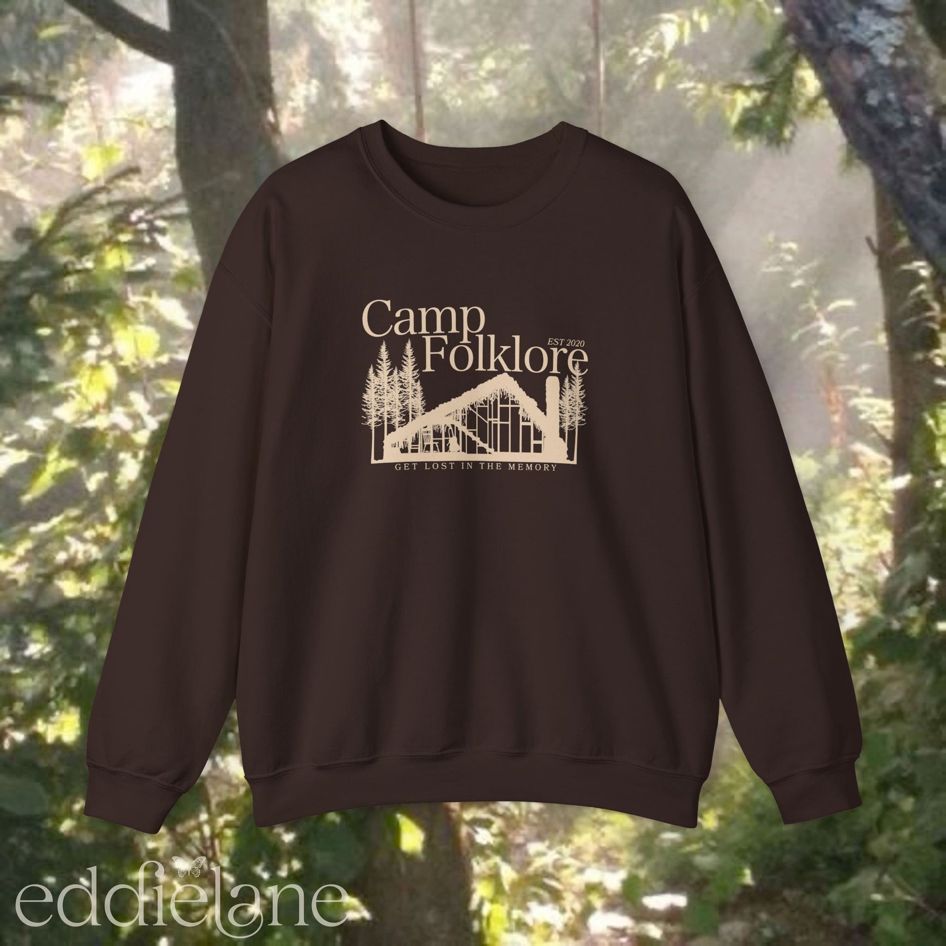 Brown sweatshirt with 'Camp Folklore' design featuring the Folklore cabin inspired by Taylor Swift's Folklore album.
camp folklore sweatshirt brown
