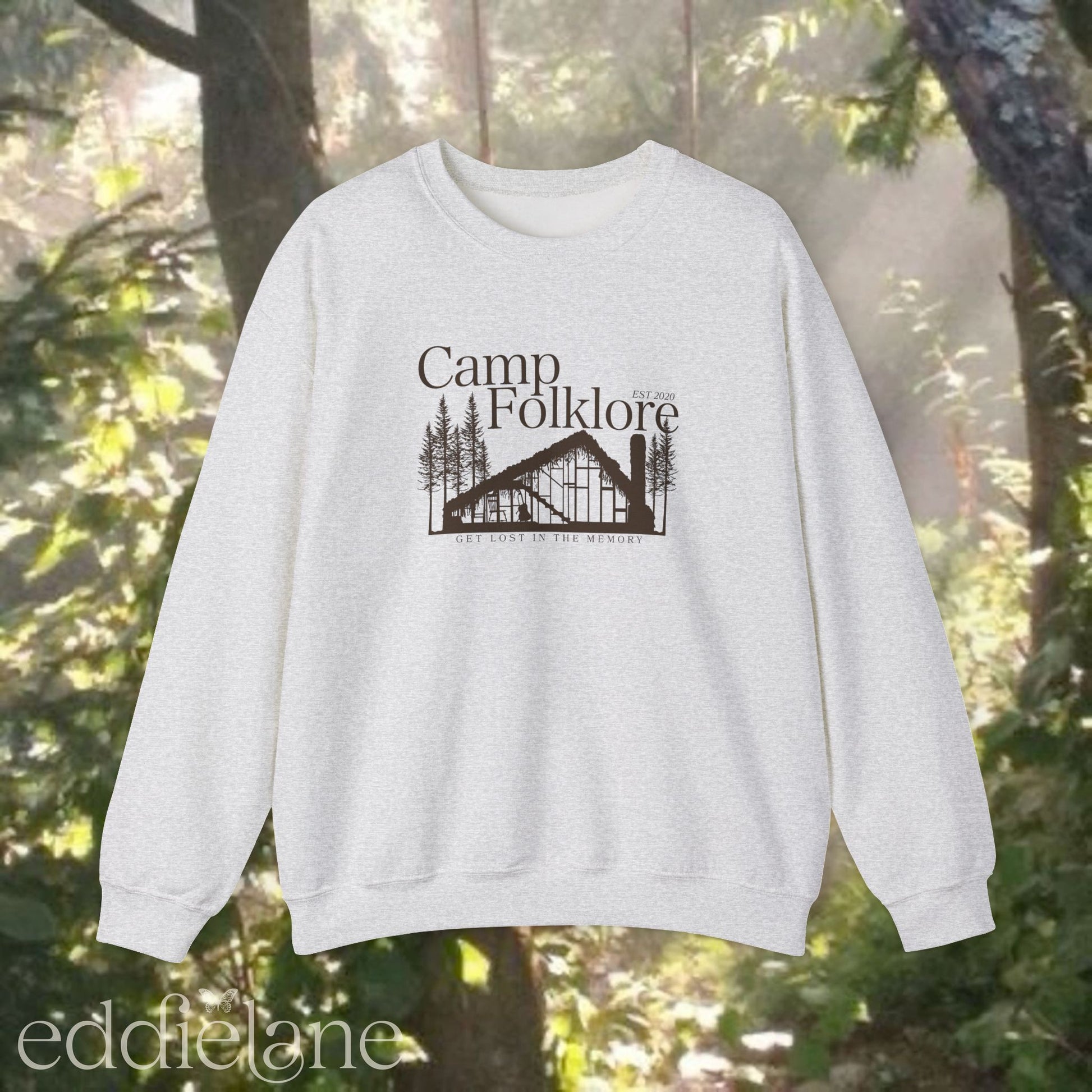 Gray sweatshirt with 'Camp Folklore' design featuring the Folklore cabin inspired by Taylor Swift's Folklore album.
camp folklore sweatshirt gray
