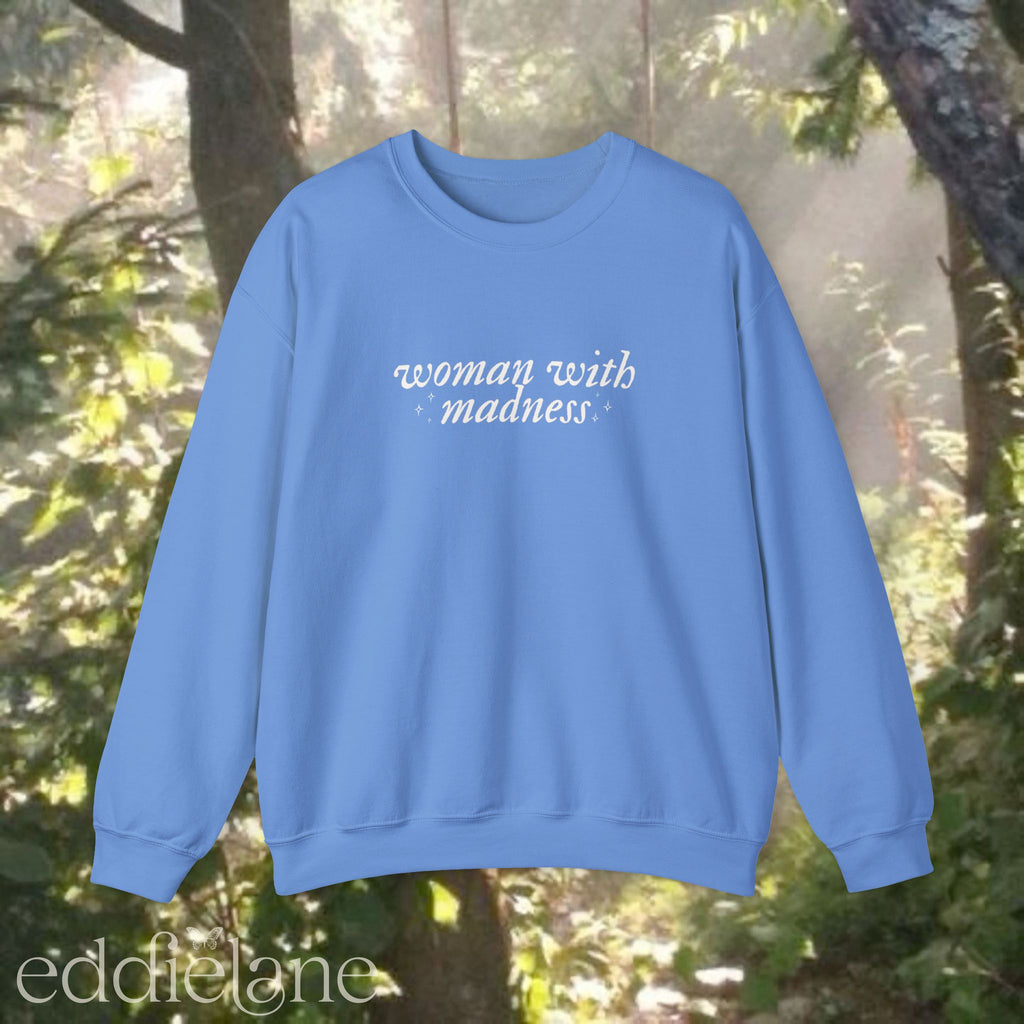 carolina blue sweatshirt with 'woman with madness' 

