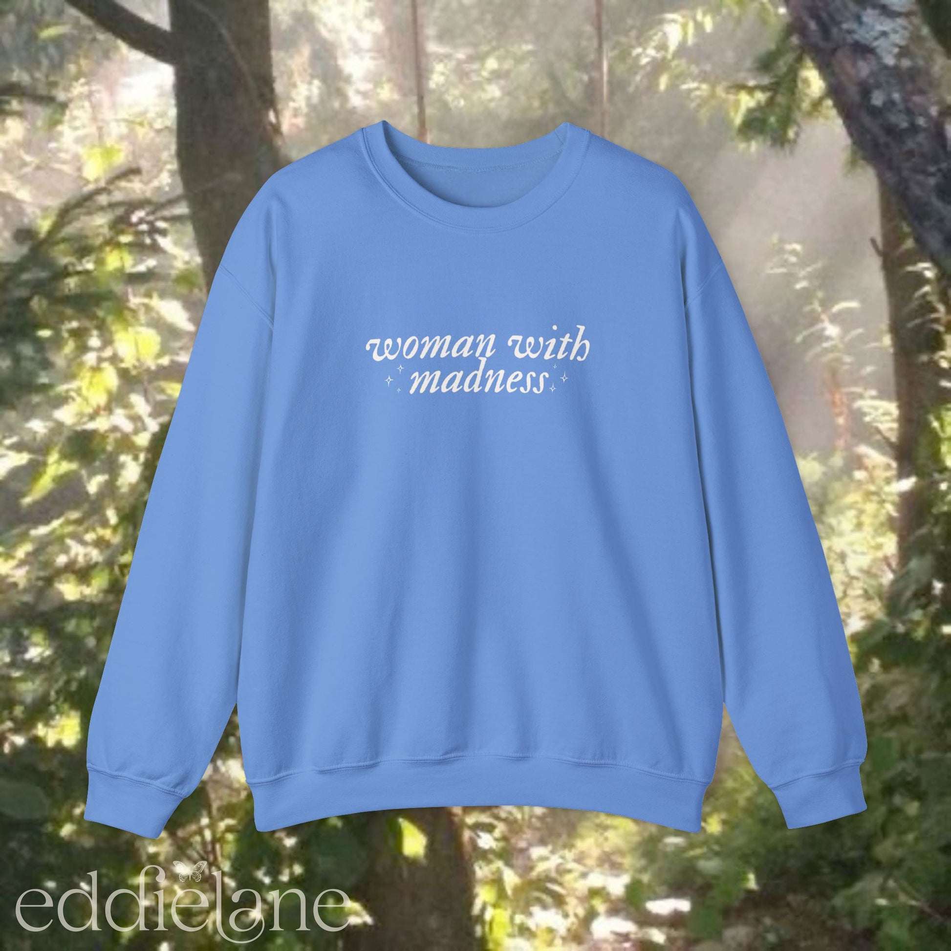 carolina blue sweatshirt with 'woman with madness' inspired by the last great american dynasty from taylor swift's folklore.
carolina blue swiftie sweatshirt woman with madness
