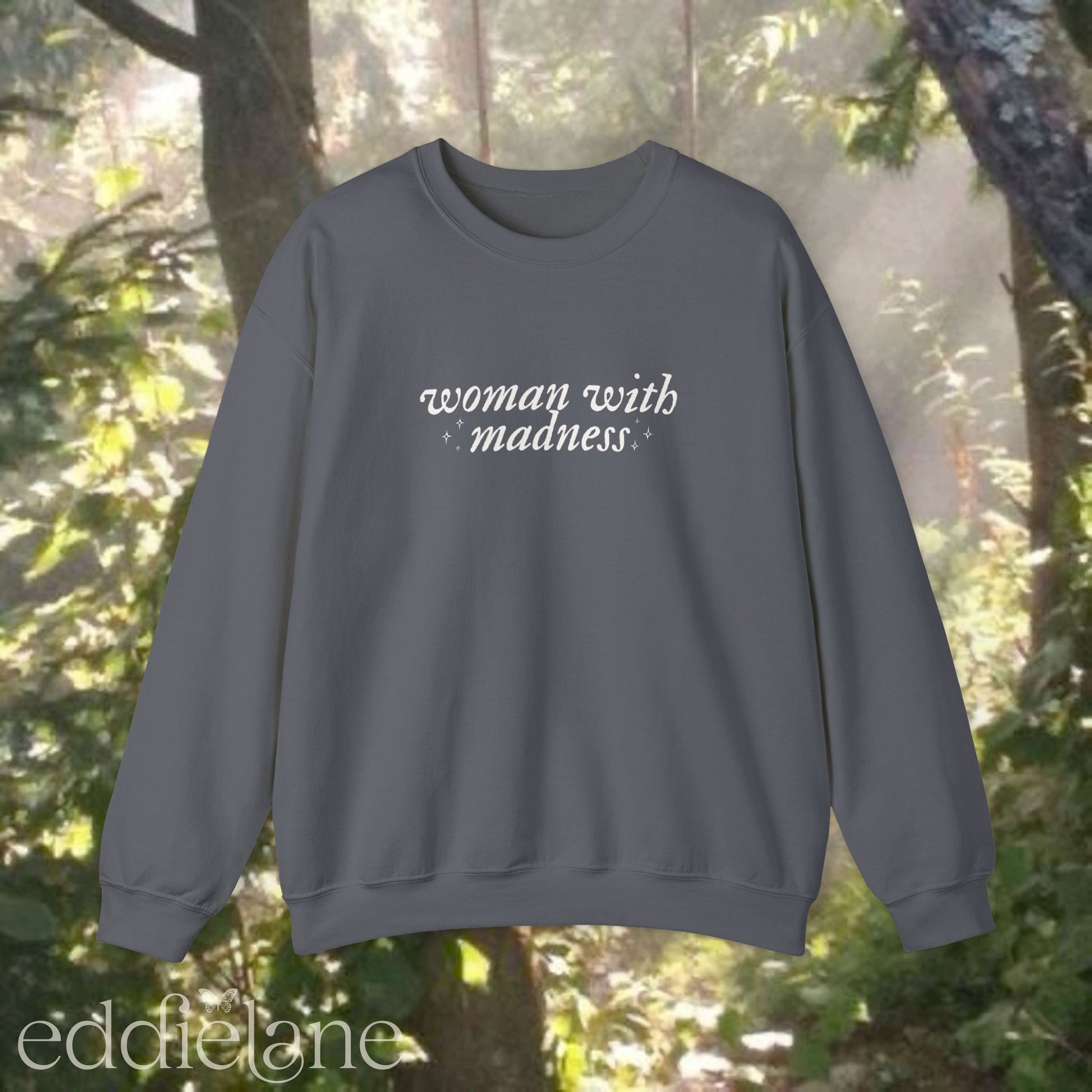 charcoal gray sweatshirt with 'woman with madness' inspired by the last great american dynasty from taylor swift's folklore.
charcoal gray swiftie sweatshirt woman with madness
