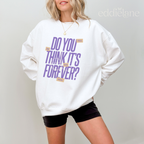 Woman wearing a white sweatshirt with purple text that says "do you think it's forever"