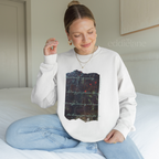 Woman wearing a white sweatshirt with a picutre of a painting and the words "Locked inside my memory and only you possess the key no longer drowning and deceived all because you came for me"