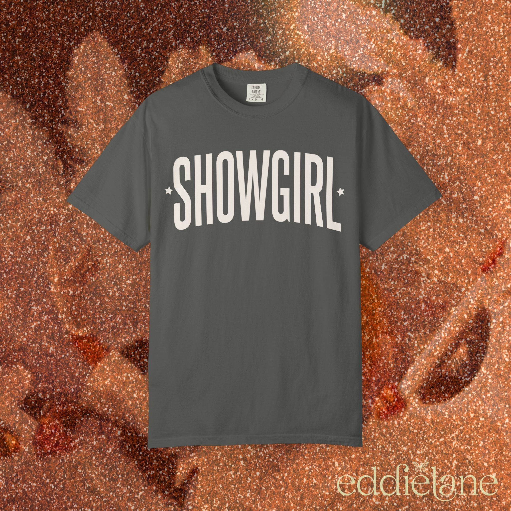 gray comfort colors graphic tee that says 'SHOWGIRL' with two small stars 

gray showgirl tee