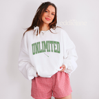 Woman wearing a white sweatshirt with 'UNLIMITED' text in a collegiate font.