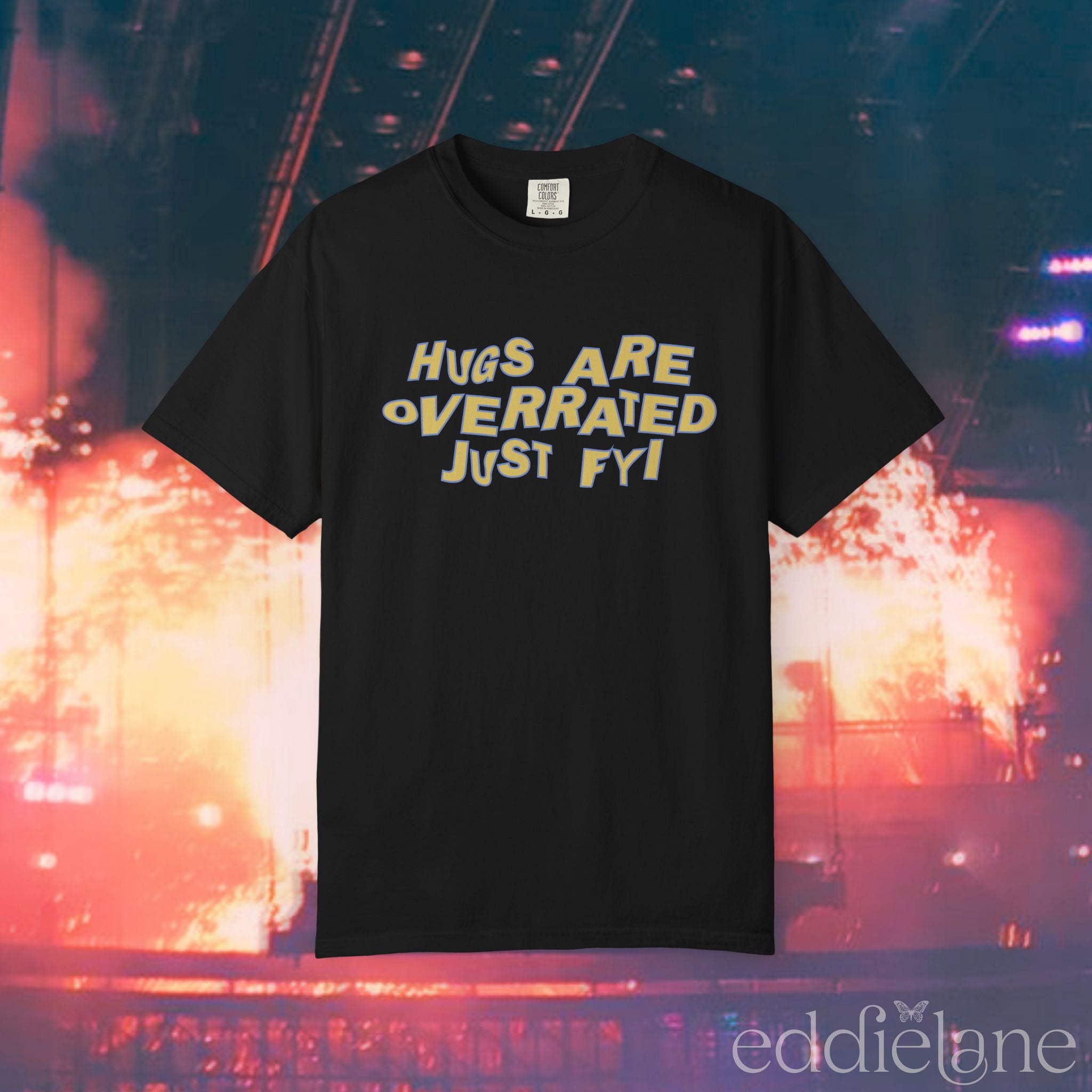 A black comfort colors t-shirt that says "hugs are overrated just fyi" 
