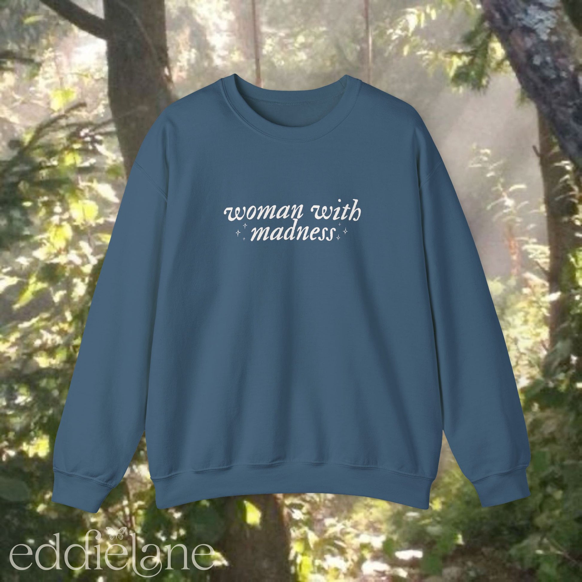 indigo blue sweatshirt with 'woman with madness' inspired by the last great american dynasty from taylor swift's folklore.
indigo blue swiftie sweatshirt woman with madness
