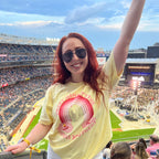 Woman in a yellow oversized graphic tee that says "sweet mama it's the jonas brothers" inspired by hannah montana. perfect for the jonas brothers concert.