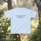 Light blue baby tee with words "woman with madness"