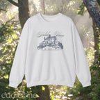 light gray crewneck sweatshirt that says "Holiday House Bed and Breakfast" 