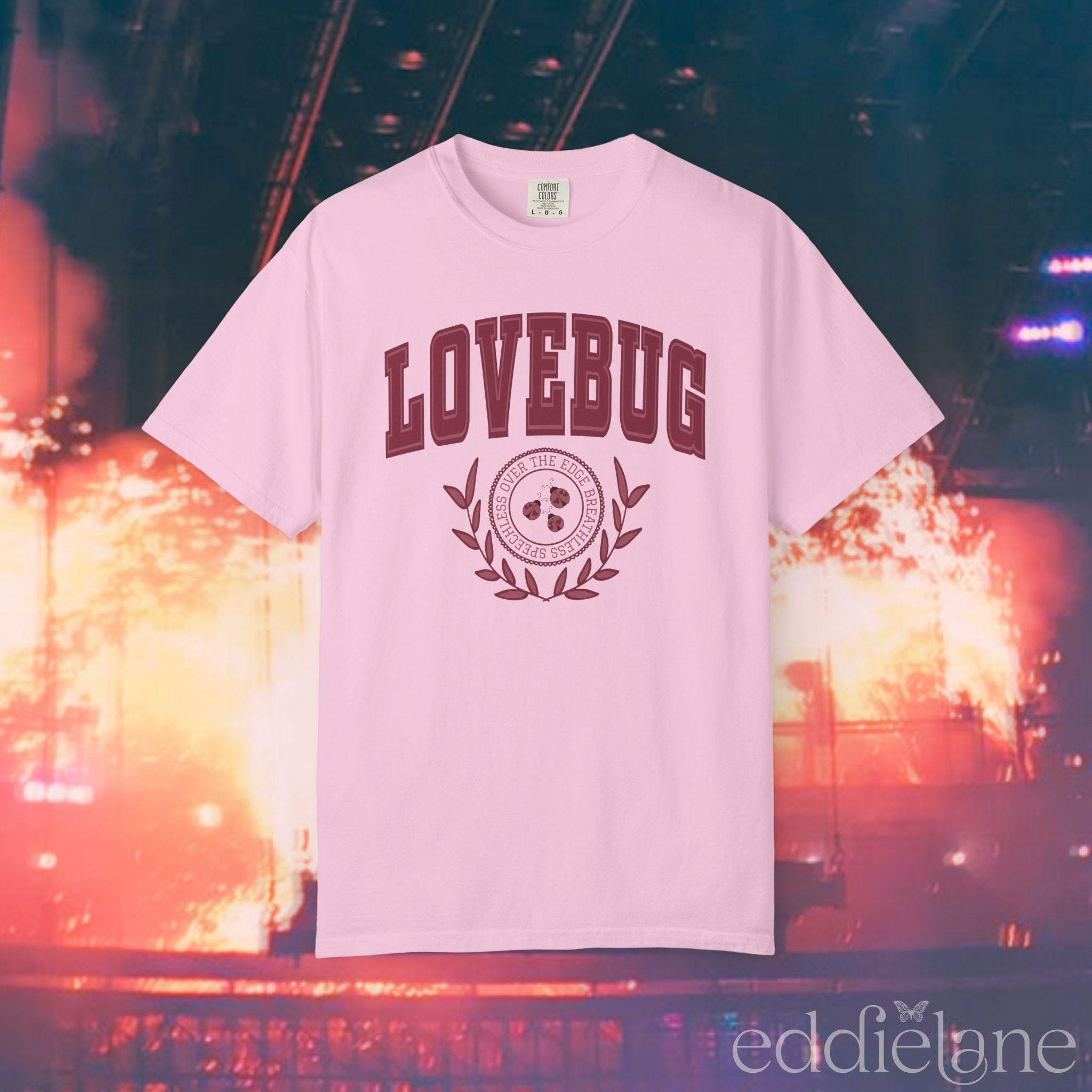 A light pink collegiate style t-shirt with red text that says "Lovebug"
