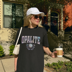 Woman wearing a black oversized t-shirt with 'OPALITE' in collegiate-style text, 