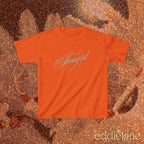 an orange baby tee with cursive text that says 'Showgirl' 

orange baby tee