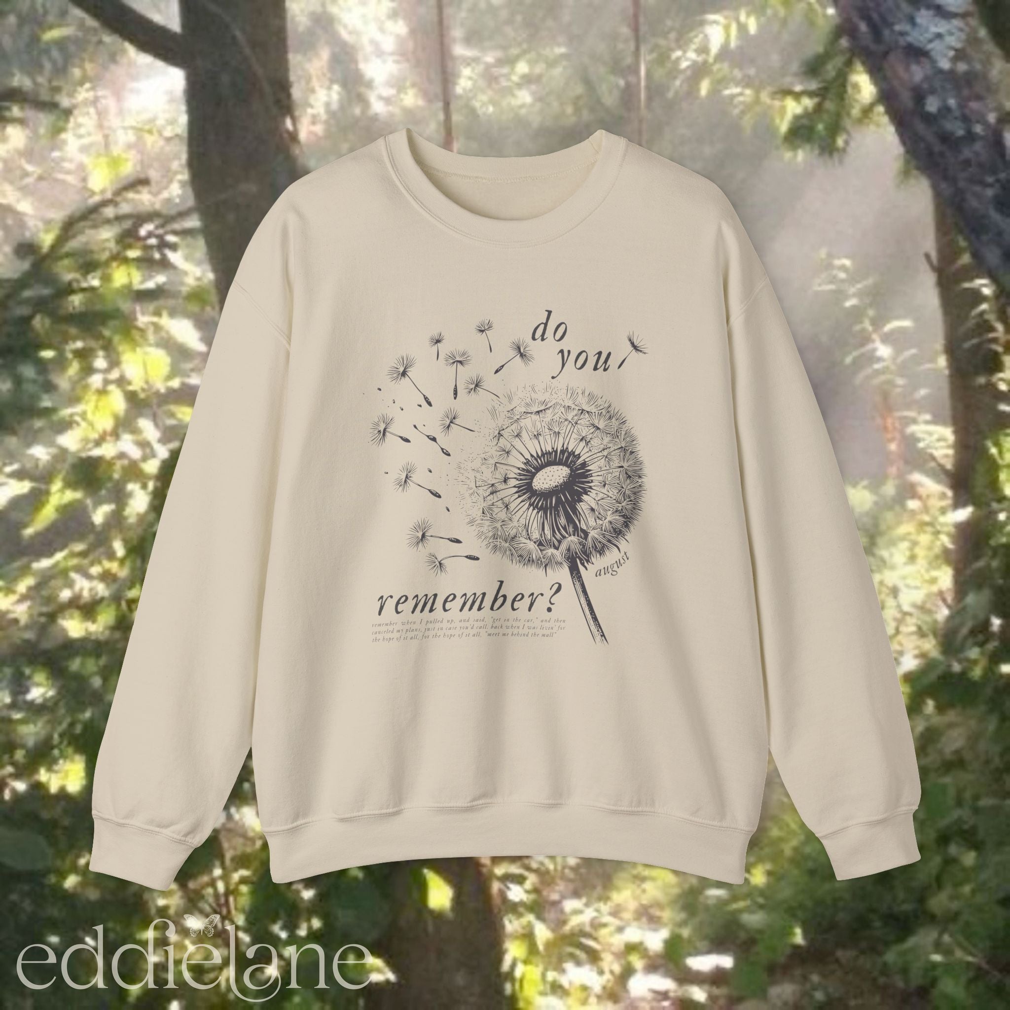 Sand sweatshirt with dandelion graphic and text that says "do you remember" 