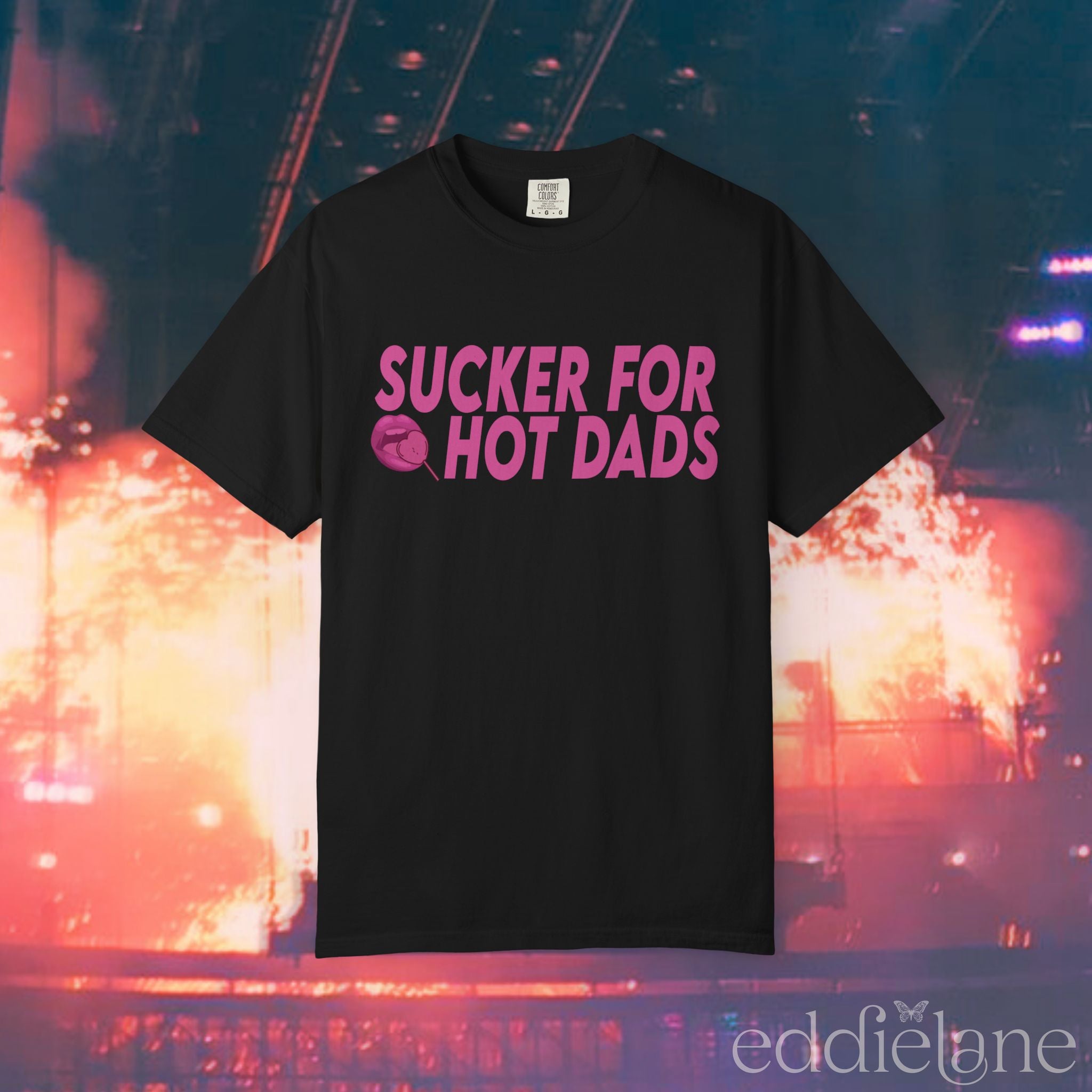 A black comfort colors t-shirt that says "sucker for hot dads" 
