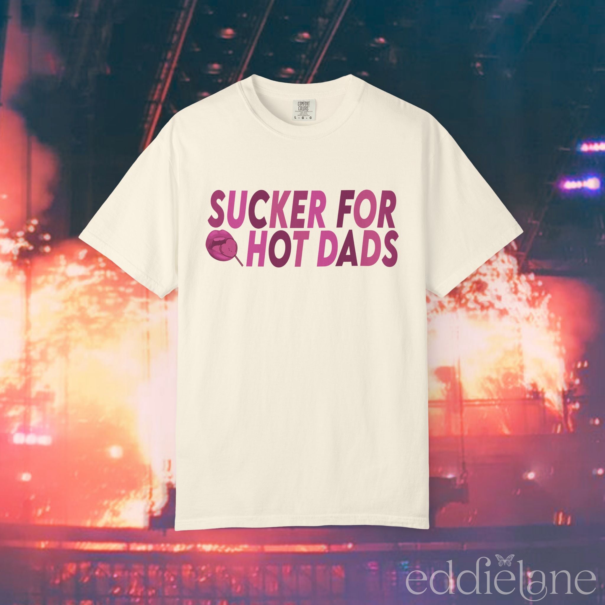 An ivory comfort colors t-shirt that says "sucker for hot dads" 