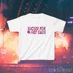 a white baby tee with dark pink design that says "sucker for hot dads" inspired by the jonas brothers.

sucker for hot dads white baby tee