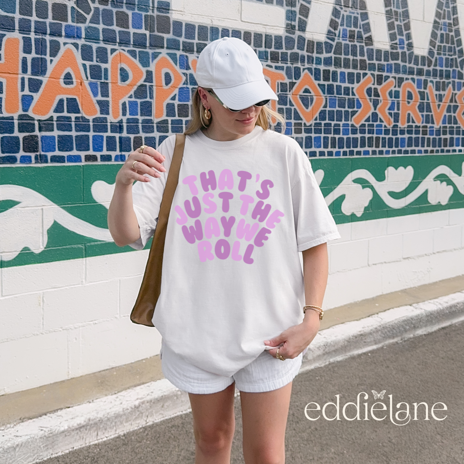 woman in a white oversized t-shirt that says "that's just the way we roll" inspired by the jonas brothers.
