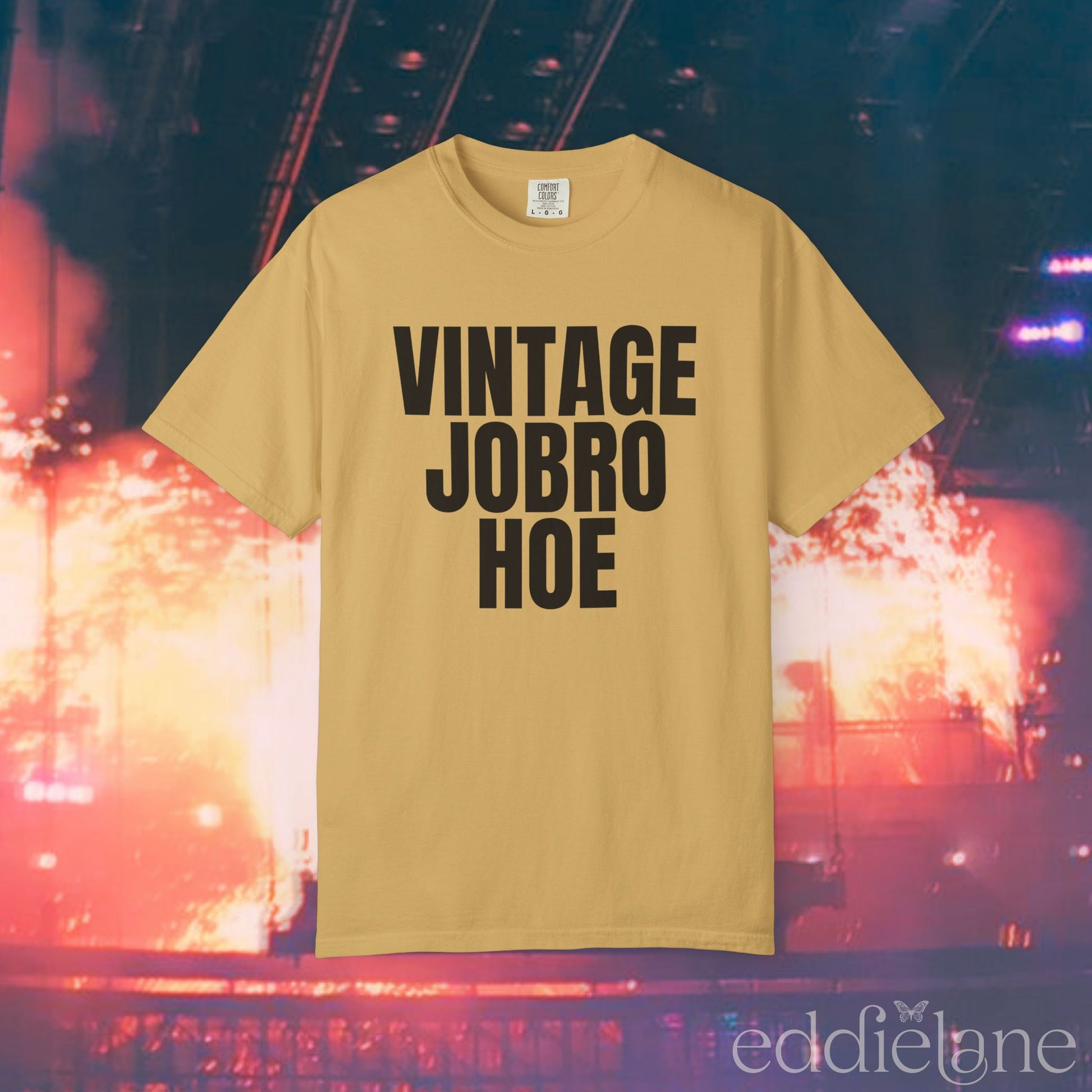 A mustard yellow t-shirt that says 'Vintage Jobro Hoe' in bold letters in black.
