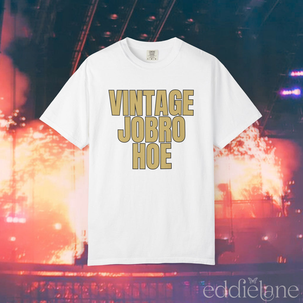 A white t-shirt that says 'Vintage Jobro Hoe' in bold letters in gold.
