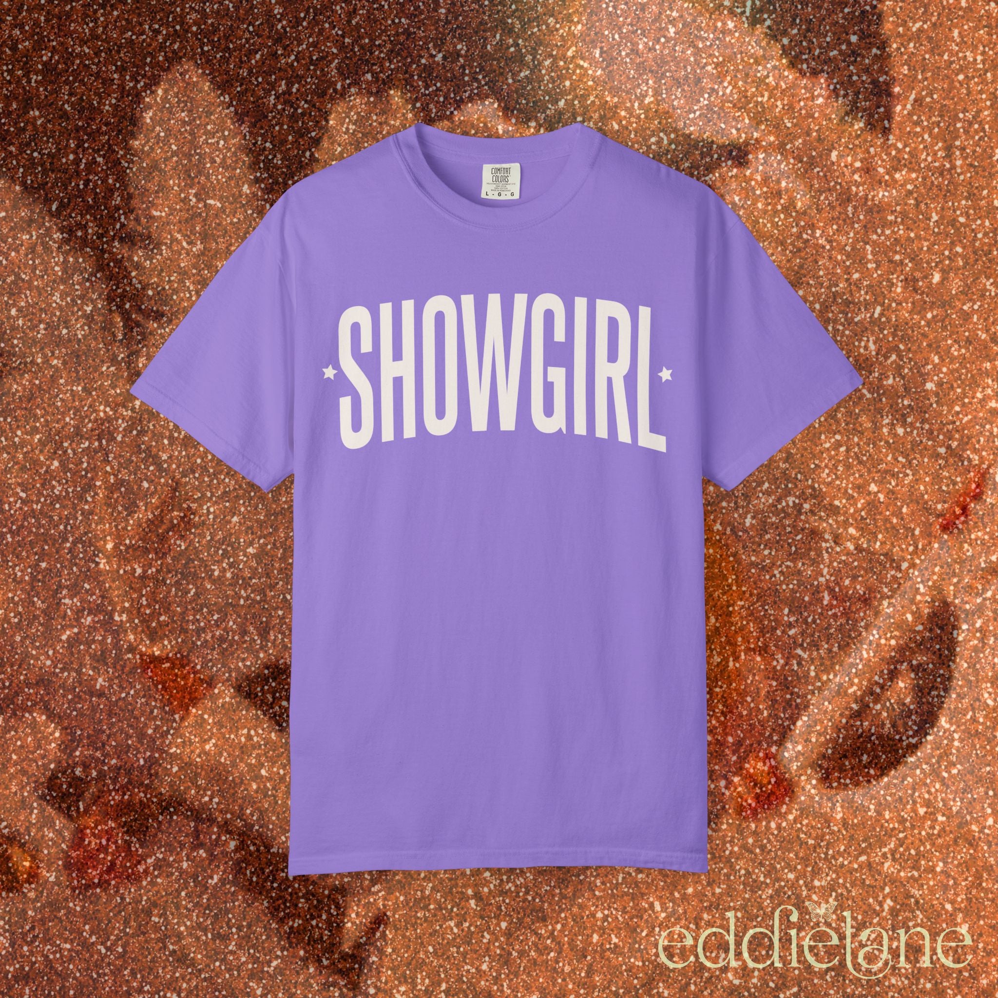 purple comfort colors graphic tee that says 'SHOWGIRL' with two small stars 

purple showgirl tee