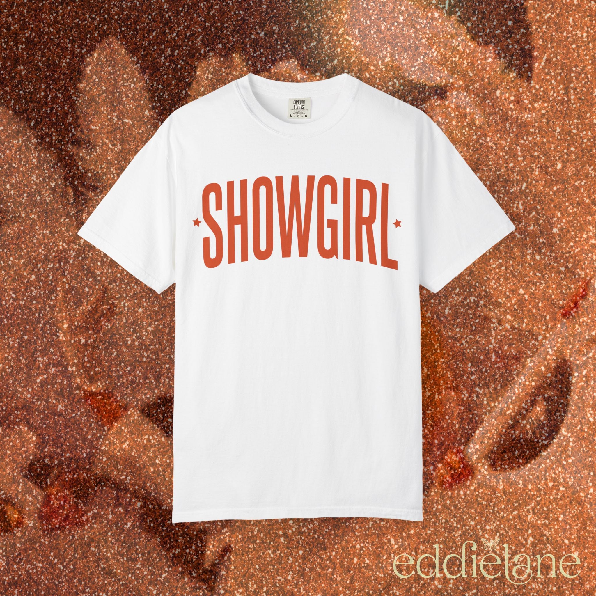 white comfort colors graphic tee that says 'SHOWGIRL' with two small stars

white showgirl tee